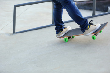 skateboarding legs at skatepark