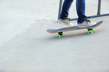 skateboarding legs at skatepark