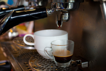 coffee machine preparing fresh coffee and pouring  in cup