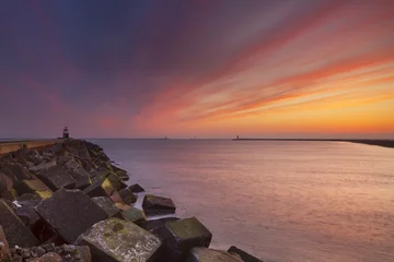 Foto op Canvas Sunset over harbour entrance of IJmuiden, The Netherlands © sara_winter