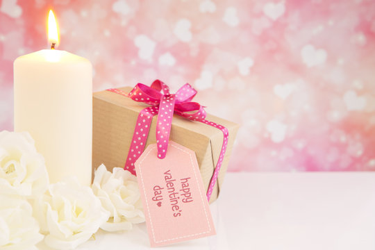 Valentine's gift and roses with a bright glittering background