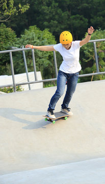 skateboarding woman at skatepark