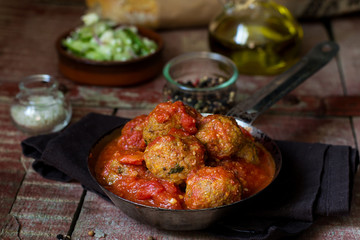 Meatballs with ground pumpkin in tomato sauce