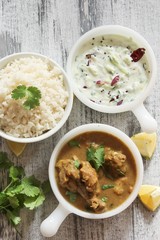 Chicken curry with rice and cucumber salad