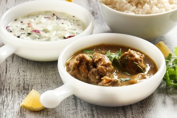 Chicken curry with rice and cucumber salad