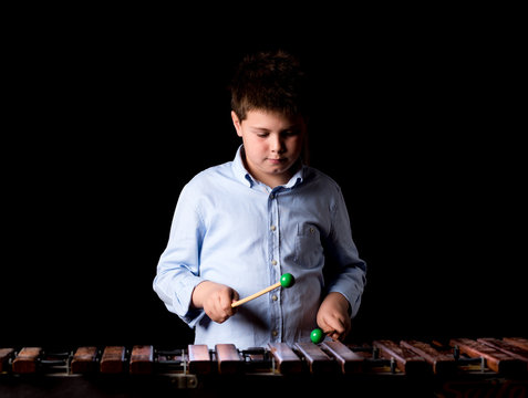 Boy Playing On Xylophone