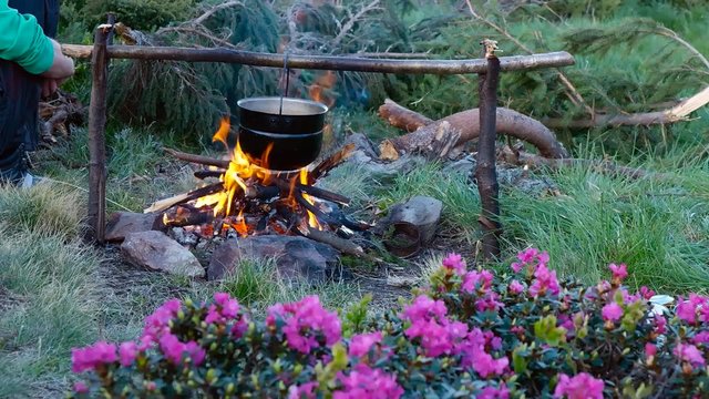 Cooking on a campfire in the mountains