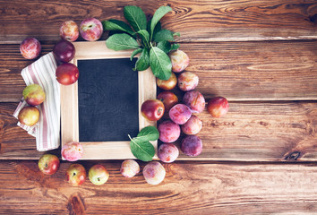Naklejka na ściany i meble Board for text with fresh plums