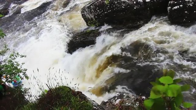 Extreme kayaking in River Moriston falls, Scotland, slow motion