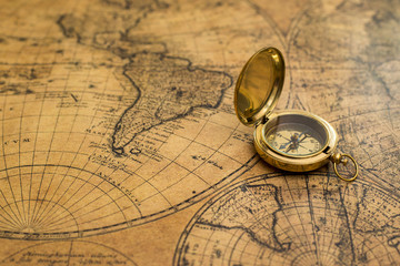 old compass on vintage map