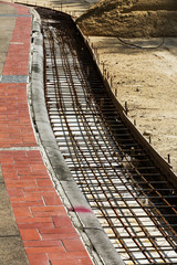 Steel rods or bars used to reinforce concrete
