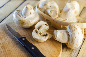 fresh champignons on a wooden Board