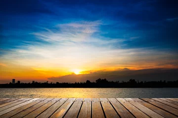 Foto op Plexiglas Wooden walkway on sunset background © fotoslaz