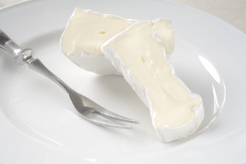 Fototapeta na wymiar french soft cheese, camembert, high key close up shot