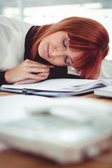 Hipster businesswoman falling in sleep at her desk