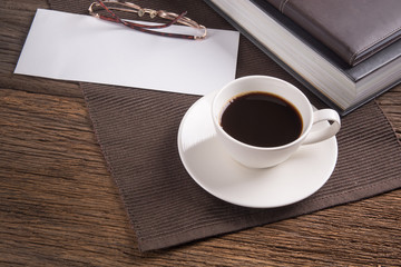 Cup of coffee with books