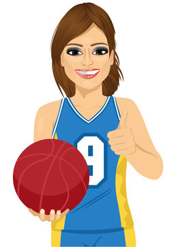 Female Basketball Player Holding Ball And Showing Thumbs Up