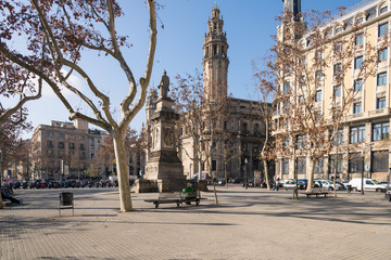 Placa de Antonio Lopez close to the main street Via Laietana in the Born/La Ribera district of Barcelona. In the background behind the monument the main post office of the Ciutat Vella and Barcelona