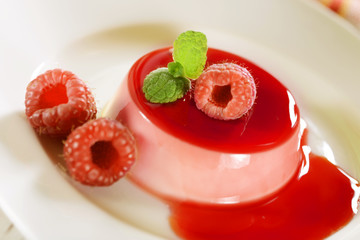 Panna cotta dessert with raspberries