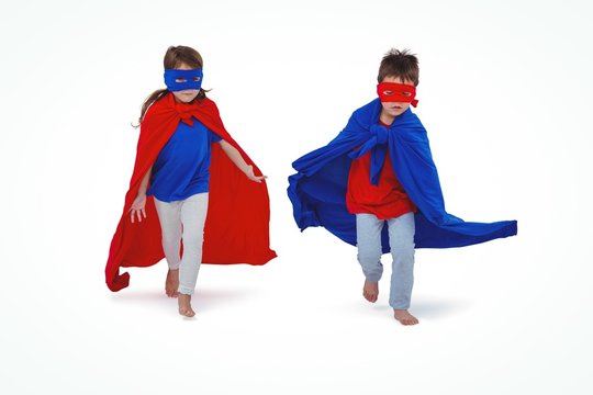 Masked kids running pretending to be superheroes