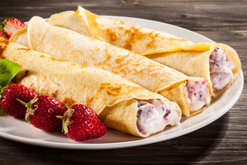 Crepes with strawberries and cream