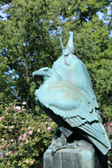 The bronze monument to a pair of eagles in the park in Helsinki