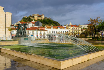 the Central area of the city with the fountain and the old castle of Leiria, Leiria, Portugal.