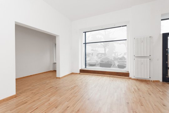 empty room newly renovated - store / shop with wooden floor and