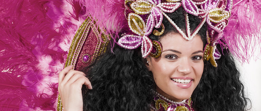 Beautiful samba dancer wearing pink costume and smiling letterbox