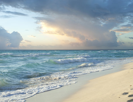 Fototapeta Morning storm clouds over beach on Caribbean Sea