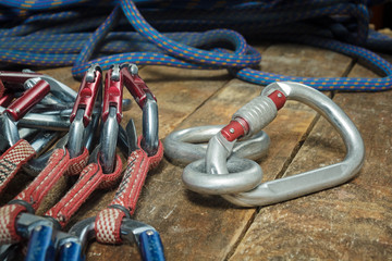 Climbing rope and equipment on wooden boards