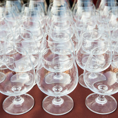 Many empty wine glasses arranged.
