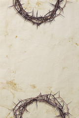 Crowns of thorns on textured background