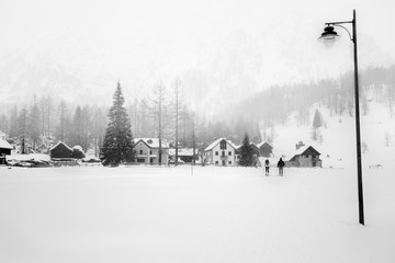Village in winter under the snow