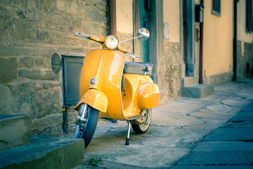 Yellow scooter in tuscan Cortona town © Maciej Czekajewski