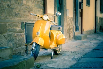 Fotobehang Yellow scooter in tuscan Cortona town © Maciej Czekajewski