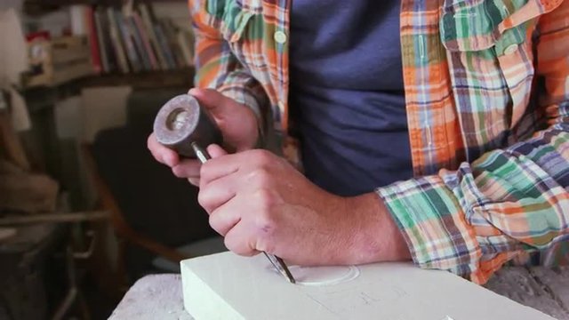 Stone Mason At Work On Carving In Studio Shot On RED Camera
