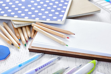Obraz premium Notebooks with stationery on a white table