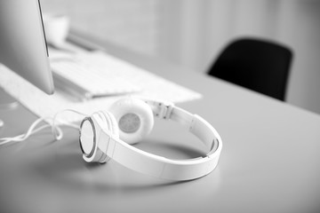 Headphones on gray table against defocused background