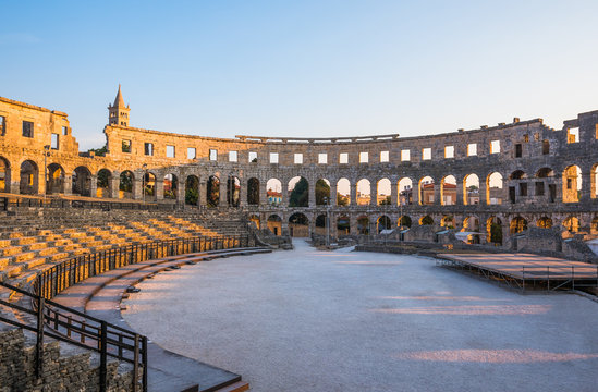Inside of Ancient Roman Amphitheater in Pula, Croatia, Famous Travel Destination, in Sunny Summer Evening