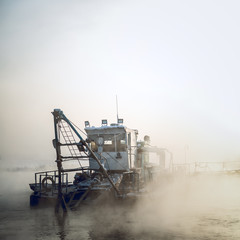 dredge boat in the fog