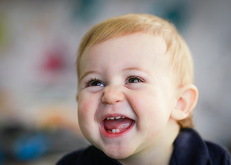 blonde baby portait - laughing baby