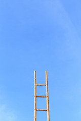 Long bamboo ladder and blue sky