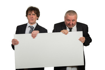 two businessmen holding a big blank sign