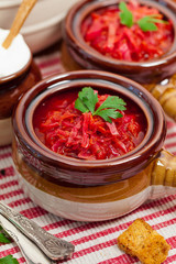 Borscht. Traditional Russian and Ukrainian national food - red beet soup. Selective focus.