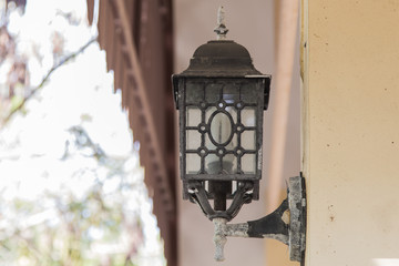 The old lantern hanging on a wall
