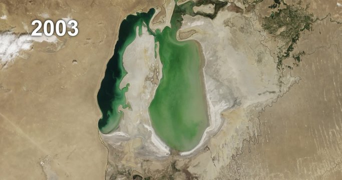Time lapse of NASA satellite images shows the Aral Sea losing water from 2000-2015, with animated label showing passage of years. 