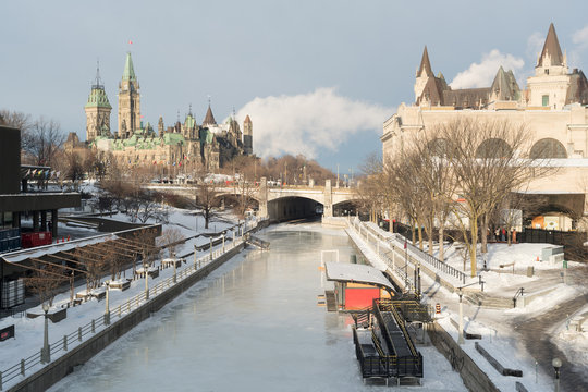 Ottawa Rideau Canal Skateway in winter with Parliament Hill and Chateau Laurier in the background