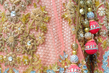 Indian embroidery on the dress, selective focus