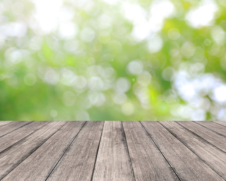 Wooden plank and bright spring bokeh background - can be used for display your products